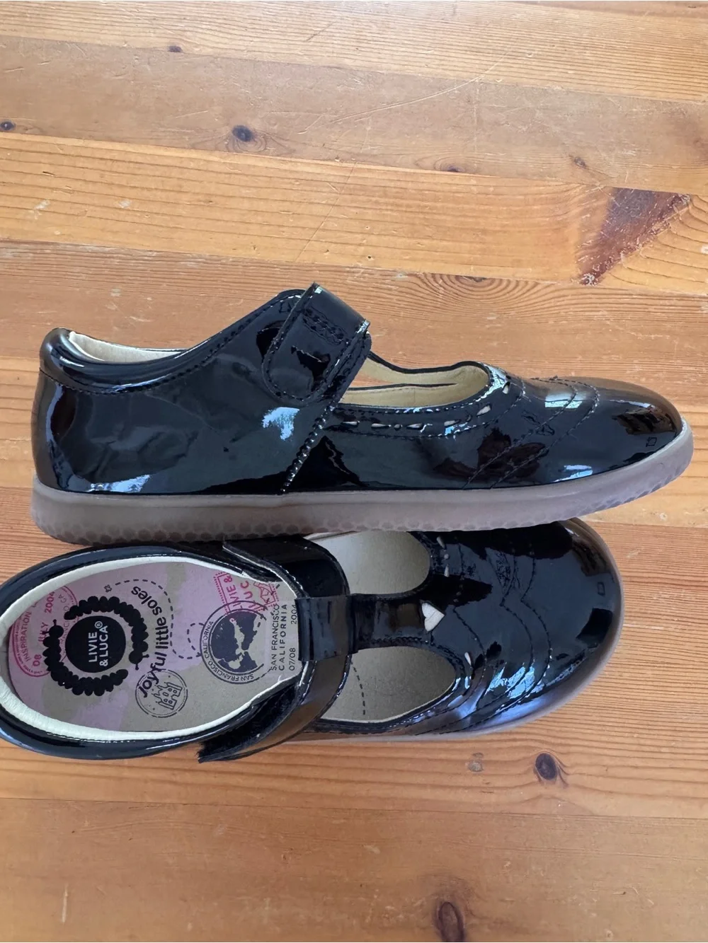 Livie & Luca Black Patent T-Strap Mary Janes with Heart Accent